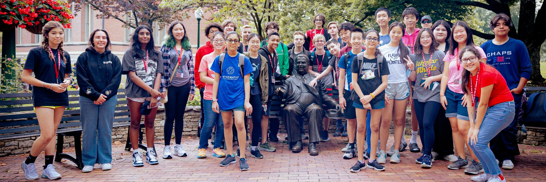 Group shot of young debaters near Herman B Wells statue