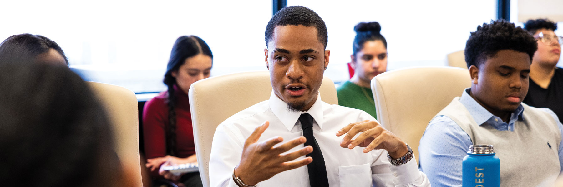 Students around conference table.