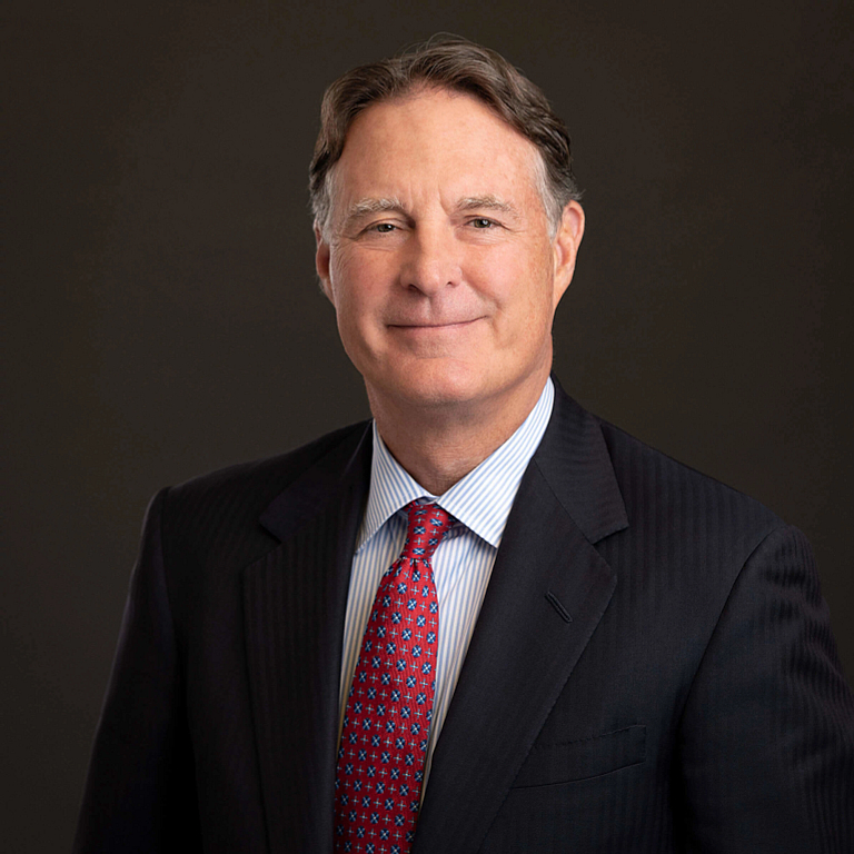 Evan Bayh in a suit and red tie.