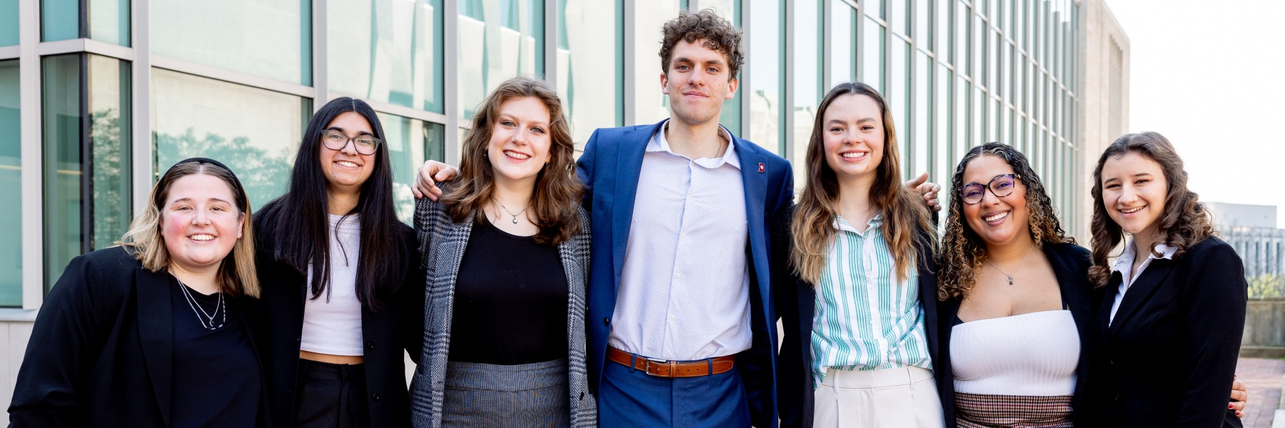Group of business dressed students in front of the O'Neill School