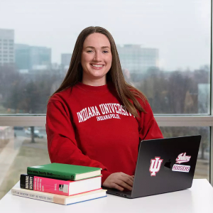 Posed photo of student in IU gear