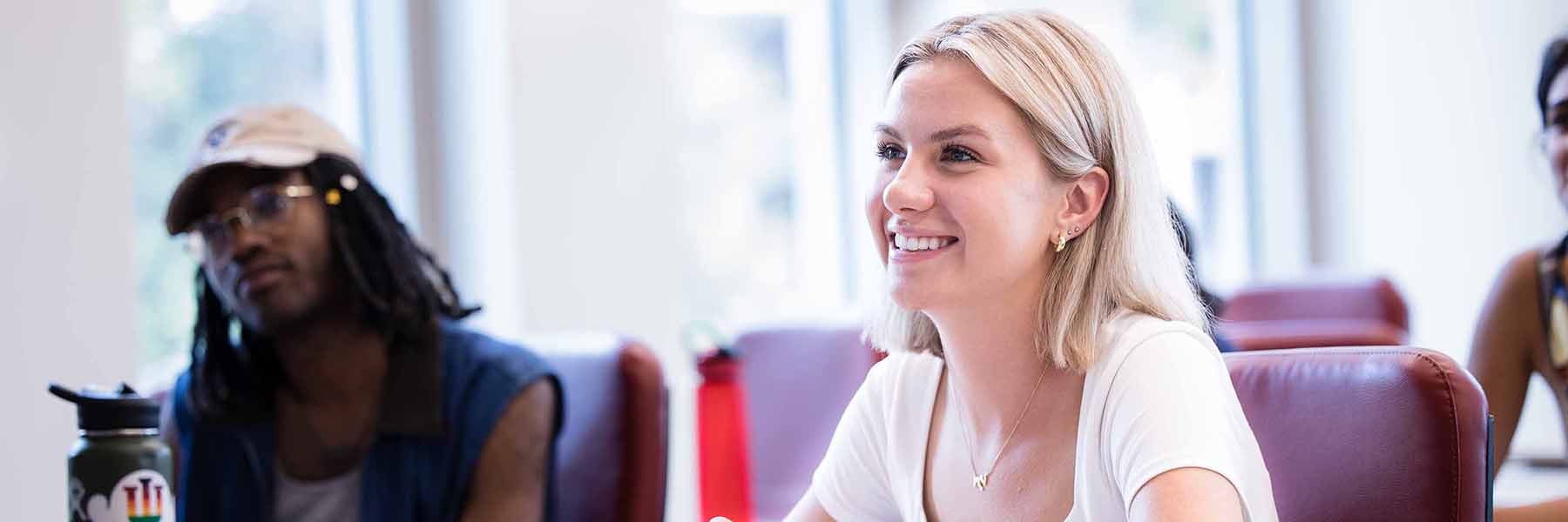 Smiling student in a classroom